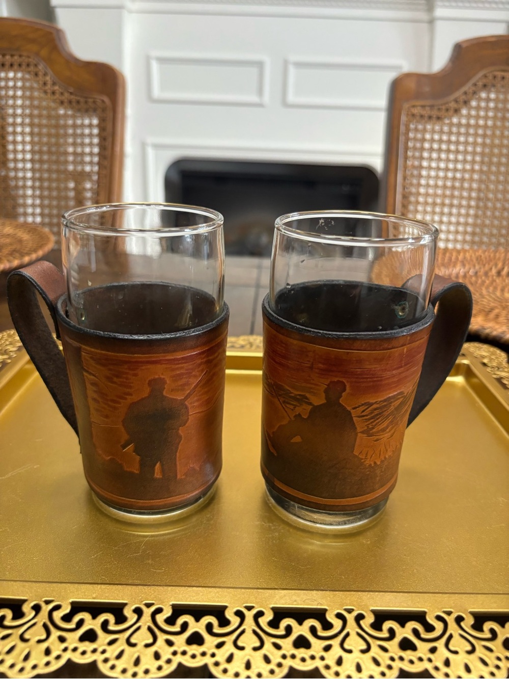 Two vintage leather wrapped hunting and fishing glass mugs with handles